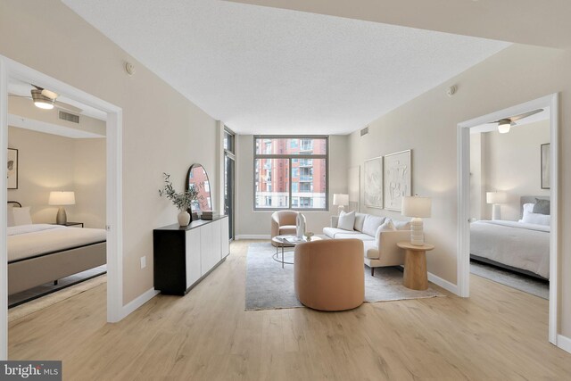 3600 S Glebe Rd Unit 321W, Arlington, VA 22202 - living area featuring light wood finished floors and baseboards