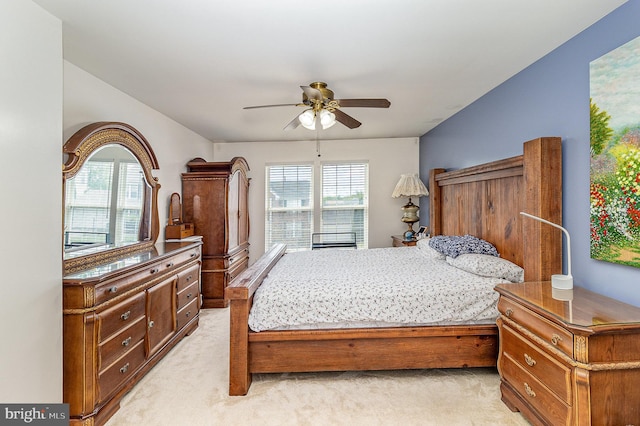bedroom featuring ceiling fan and light colored carpet