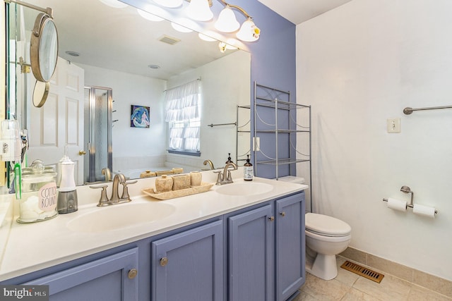full bathroom featuring visible vents, toilet, double vanity, and a sink