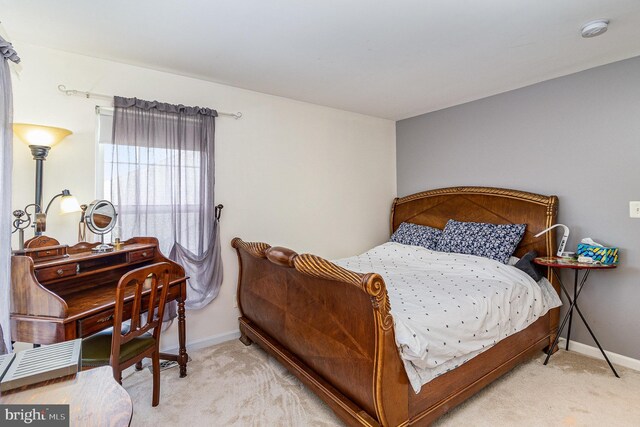 bedroom with carpet and baseboards