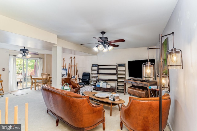 living room with a ceiling fan and carpet