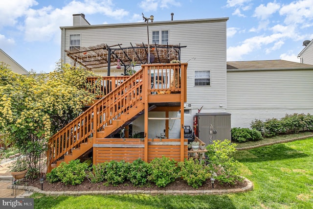 rear view of house featuring a pergola, a deck, stairway, and a shed