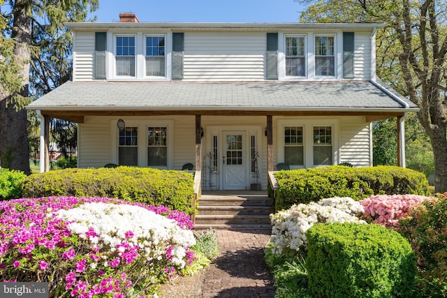 1822 Clearwood Rd, Baltimore, MD 21234 - view of front of house with covered porch and a chimney