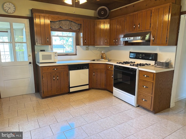 1822 Clearwood Rd, Baltimore, MD 21234 - kitchen featuring white appliances, range hood, a sink, light countertops, and brown cabinets