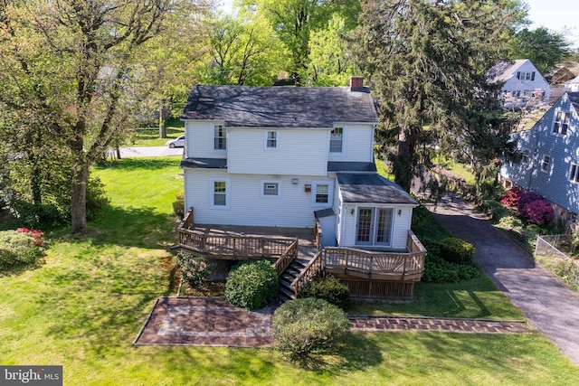 1822 Clearwood Rd, Baltimore, MD 21234 - rear view of house with a wooden deck, a chimney, and a lawn