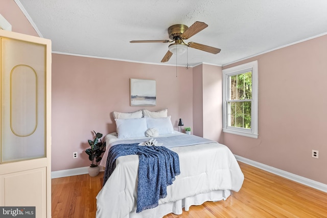 1822 Clearwood Rd, Baltimore, MD 21234 - bedroom with baseboards, wood finished floors, a textured ceiling, crown molding, and ceiling fan
