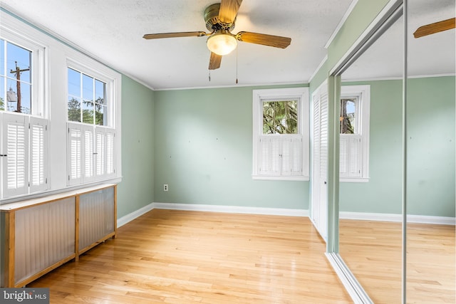 1822 Clearwood Rd, Baltimore, MD 21234 - unfurnished bedroom featuring wood finished floors, baseboards, ornamental molding, ceiling fan, and a closet