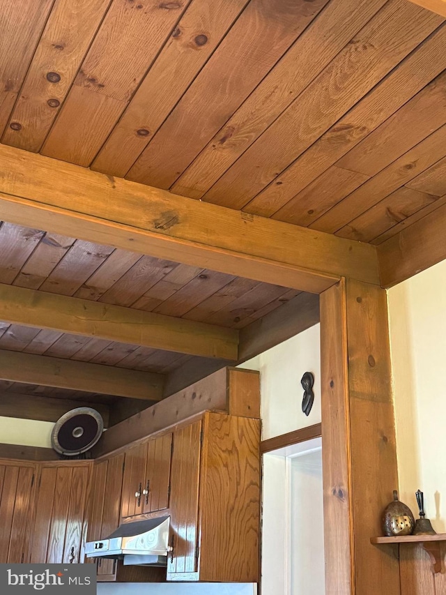 1822 Clearwood Rd, Baltimore, MD 21234 - detailed view of under cabinet range hood, wooden ceiling with exposed beams, and brown cabinets