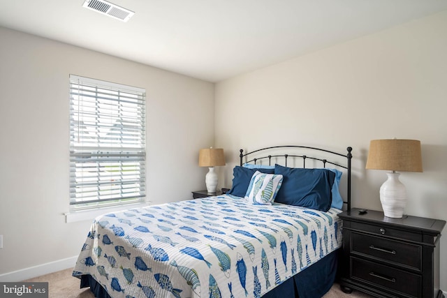 bedroom featuring carpet floors, baseboards, and visible vents