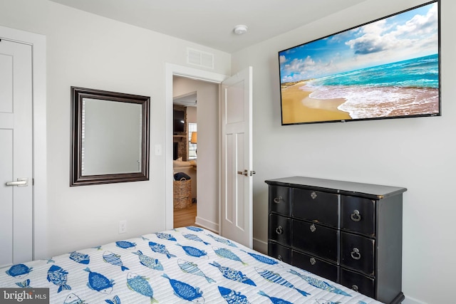 bedroom featuring visible vents