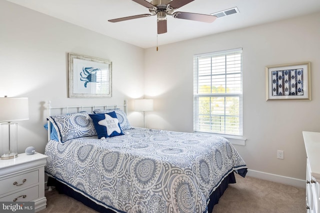 bedroom featuring carpet floors, a ceiling fan, baseboards, and visible vents