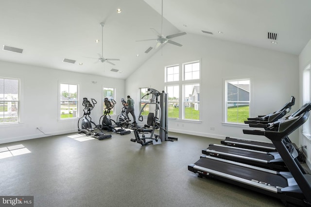 gym with baseboards, plenty of natural light, and visible vents