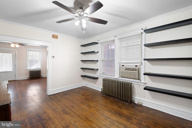 spare room featuring a ceiling fan, ornamental molding, and radiator