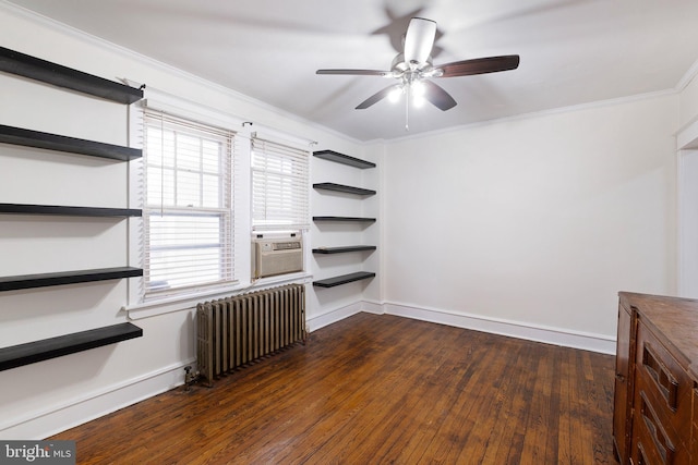 empty room with ceiling fan, baseboards, radiator, ornamental molding, and dark wood-type flooring