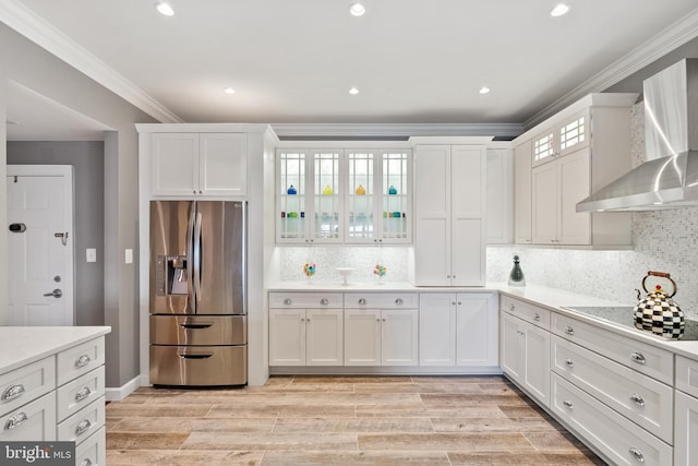 525 Belmont Bay Dr Unit 405, Woodbridge, VA 22191 - kitchen featuring ornamental molding, wall chimney range hood, stainless steel refrigerator with ice dispenser, and white cabinets