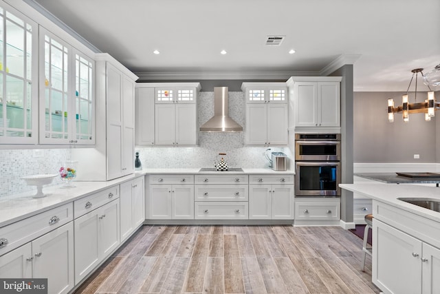 525 Belmont Bay Dr Unit 405, Woodbridge, VA 22191 - kitchen featuring wall chimney exhaust hood, stainless steel double oven, white cabinets, visible vents, and black electric stovetop