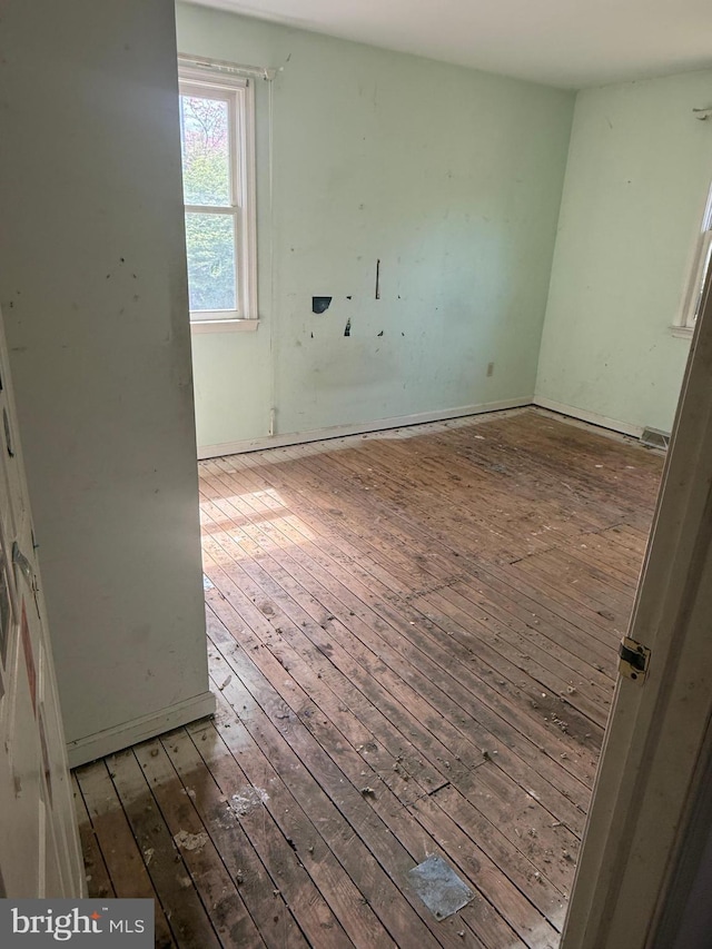 spare room with hardwood / wood-style floors