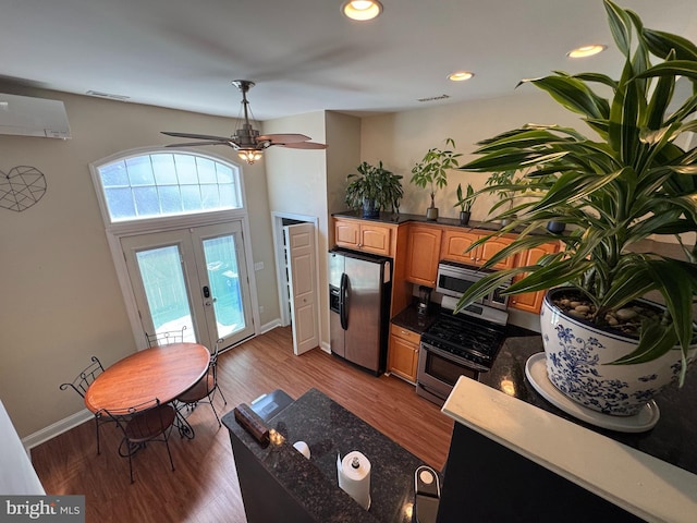 interior space with a ceiling fan, french doors, baseboards, recessed lighting, and dark wood-type flooring