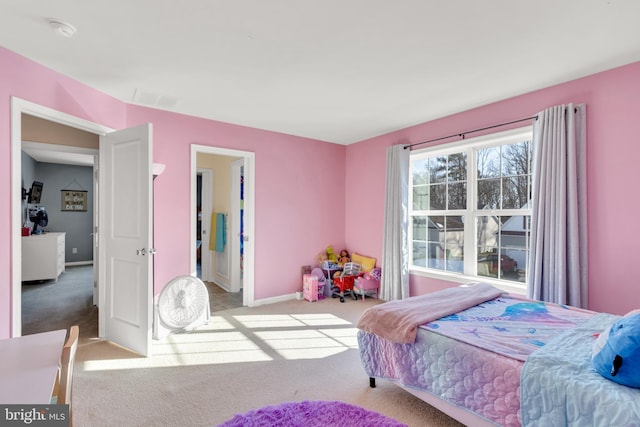 carpeted bedroom with visible vents and baseboards