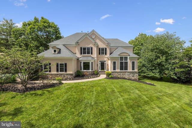 1418 Woodhurst Blvd, Mclean, VA 22102 - view of front of property featuring stone siding, stucco siding, and a front yard