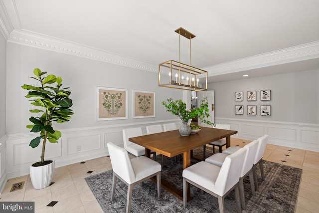 1418 Woodhurst Blvd, Mclean, VA 22102 - dining space featuring light tile patterned floors, a decorative wall, ornamental molding, a chandelier, and wainscoting