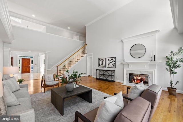 1418 Woodhurst Blvd, Mclean, VA 22102 - living room featuring a premium fireplace, decorative columns, wood finished floors, ornamental molding, and recessed lighting
