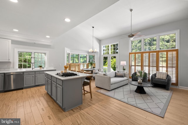 1418 Woodhurst Blvd, Mclean, VA 22102 - kitchen with dishwasher, gray cabinetry, gas stovetop, a center island, and light countertops