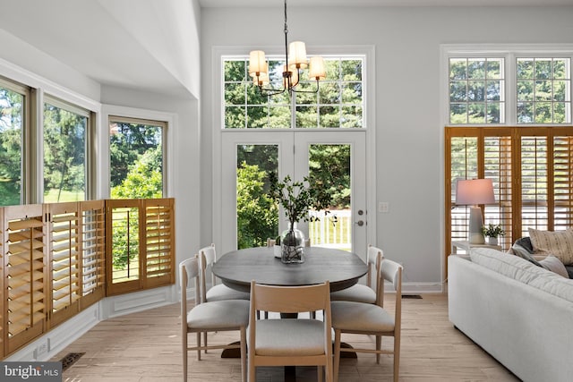 1418 Woodhurst Blvd, Mclean, VA 22102 - dining space featuring a chandelier, plenty of natural light, and light wood finished floors