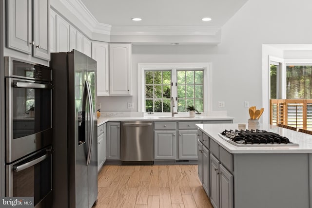 1418 Woodhurst Blvd, Mclean, VA 22102 - kitchen featuring gray cabinets, appliances with stainless steel finishes, light countertops, crown molding, and recessed lighting