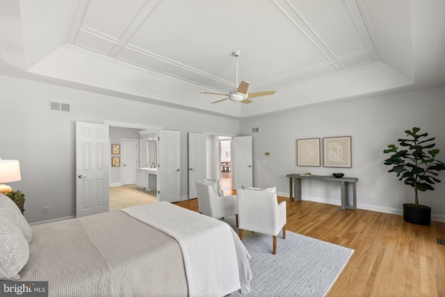 1418 Woodhurst Blvd, Mclean, VA 22102 - bedroom featuring a tray ceiling, light wood-type flooring, baseboards, ensuite bath, and ceiling fan