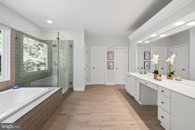 1418 Woodhurst Blvd, Mclean, VA 22102 - full bath with vanity, a shower stall, a garden tub, wood finished floors, and baseboards