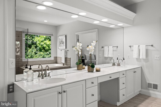 1418 Woodhurst Blvd, Mclean, VA 22102 - full bathroom with double vanity, recessed lighting, a bath, and wood finished floors