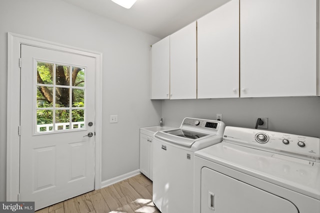 1418 Woodhurst Blvd, Mclean, VA 22102 - laundry area with cabinet space, washing machine and dryer, light wood-style floors, and baseboards