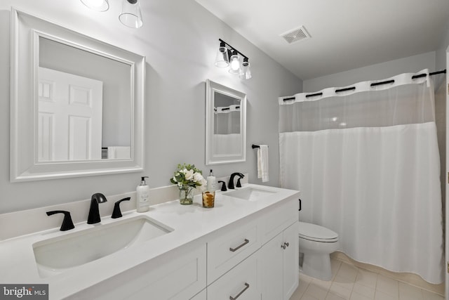 1418 Woodhurst Blvd, Mclean, VA 22102 - full bath with toilet, double vanity, tile patterned flooring, and curtained shower