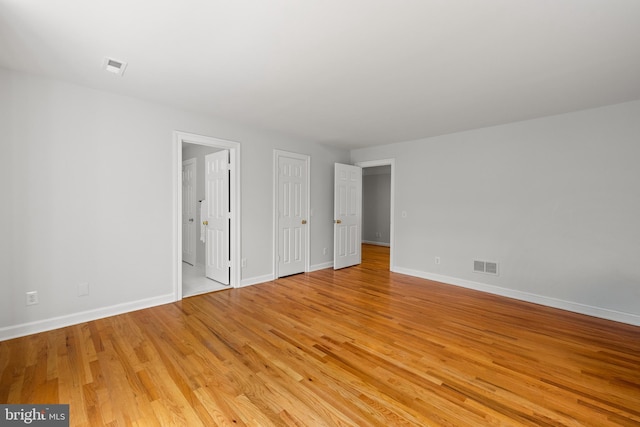 1418 Woodhurst Blvd, Mclean, VA 22102 - unfurnished bedroom with light wood-style flooring and baseboards