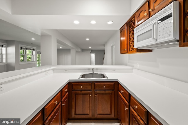 1418 Woodhurst Blvd, Mclean, VA 22102 - kitchen featuring a sink, white microwave, recessed lighting, light countertops, and a peninsula