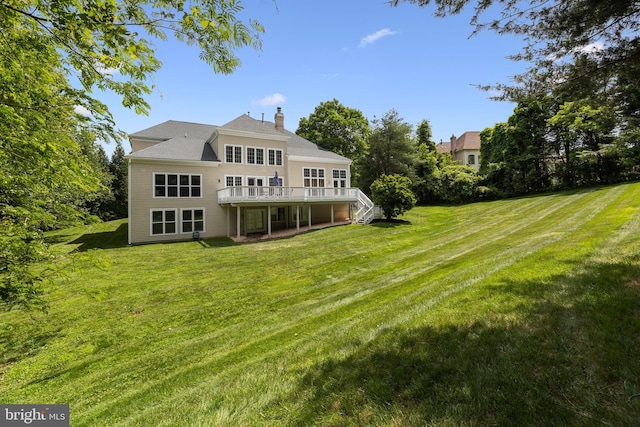 1418 Woodhurst Blvd, Mclean, VA 22102 - rear view of house with a chimney, a lawn, a wooden deck, and stairs