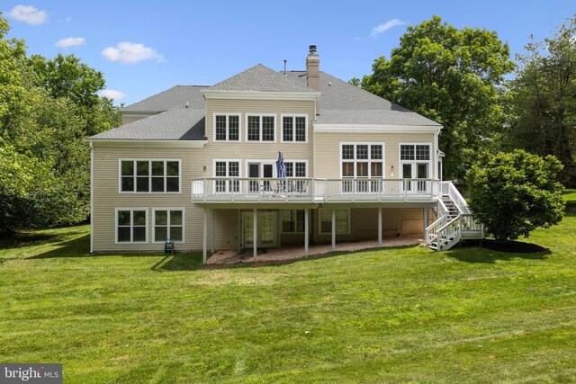 1418 Woodhurst Blvd, Mclean, VA 22102 - rear view of property with a wooden deck, a lawn, stairs, a chimney, and roof with shingles