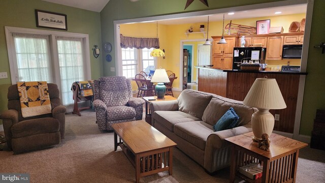 carpeted living room featuring lofted ceiling and recessed lighting