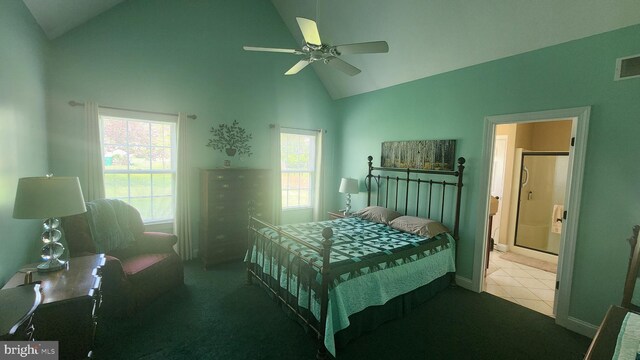 bedroom featuring connected bathroom, baseboards, visible vents, a ceiling fan, and high vaulted ceiling