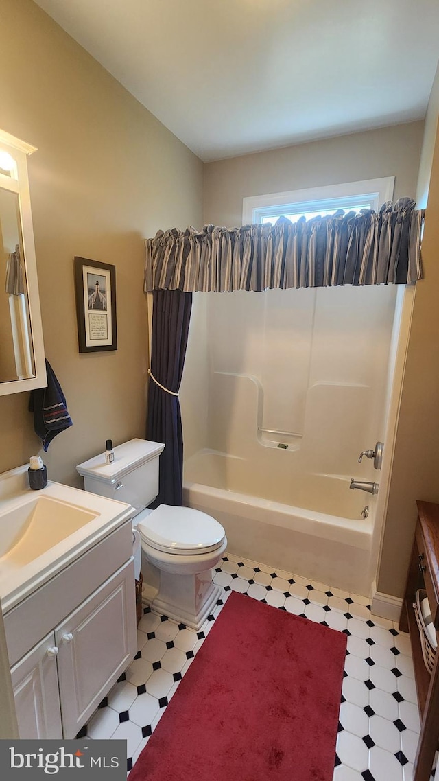 full bathroom with tile patterned floors, toilet, bathtub / shower combination, and vanity