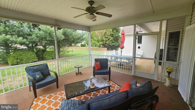 view of patio featuring outdoor lounge area, a ceiling fan, and a deck