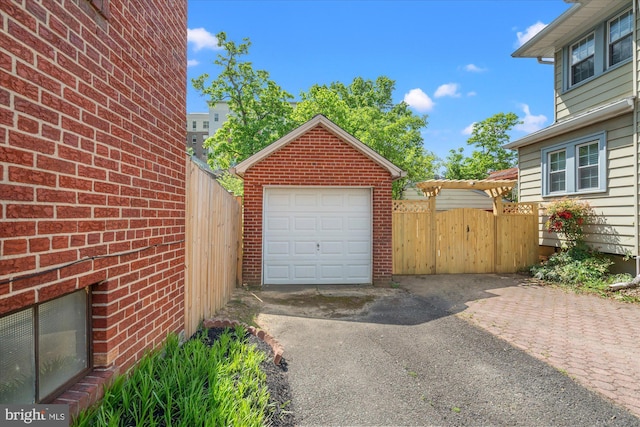 3512 9th St S, Arlington, VA 22204 - detached garage featuring fence and driveway