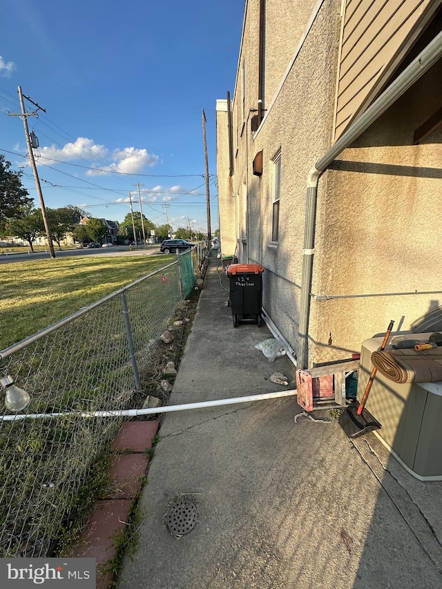 128 Thurlow St, Chester, PA 19013 - view of side of home featuring stucco siding and fence