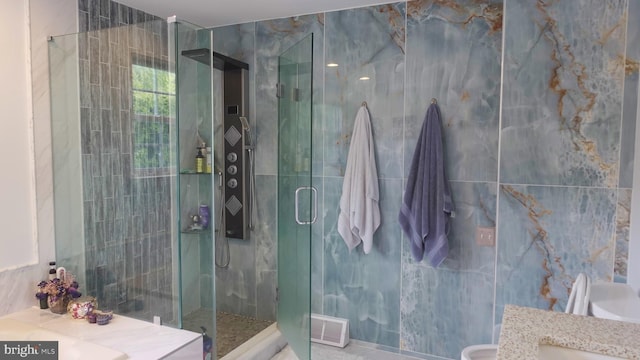 full bath with visible vents, a shower stall, and vanity