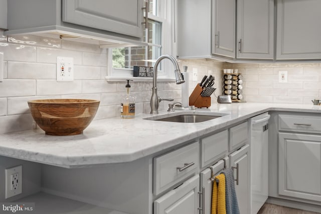 kitchen featuring a sink and backsplash