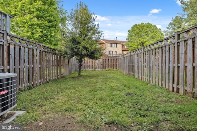 view of yard with central AC