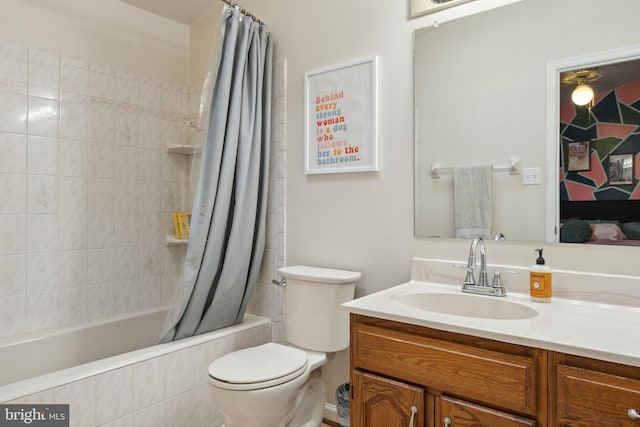 full bathroom with toilet, vanity, and tiled shower / bath combo