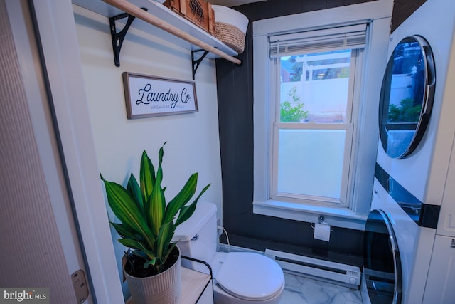 623 Marietta Ave, Lancaster, PA 17603 - bathroom featuring baseboard heating, stacked washer / dryer, and toilet