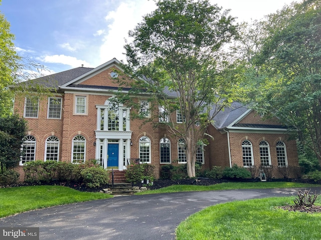 15410 River Rd, Darnestown, MD 20874 - georgian-style home featuring brick siding and a front lawn